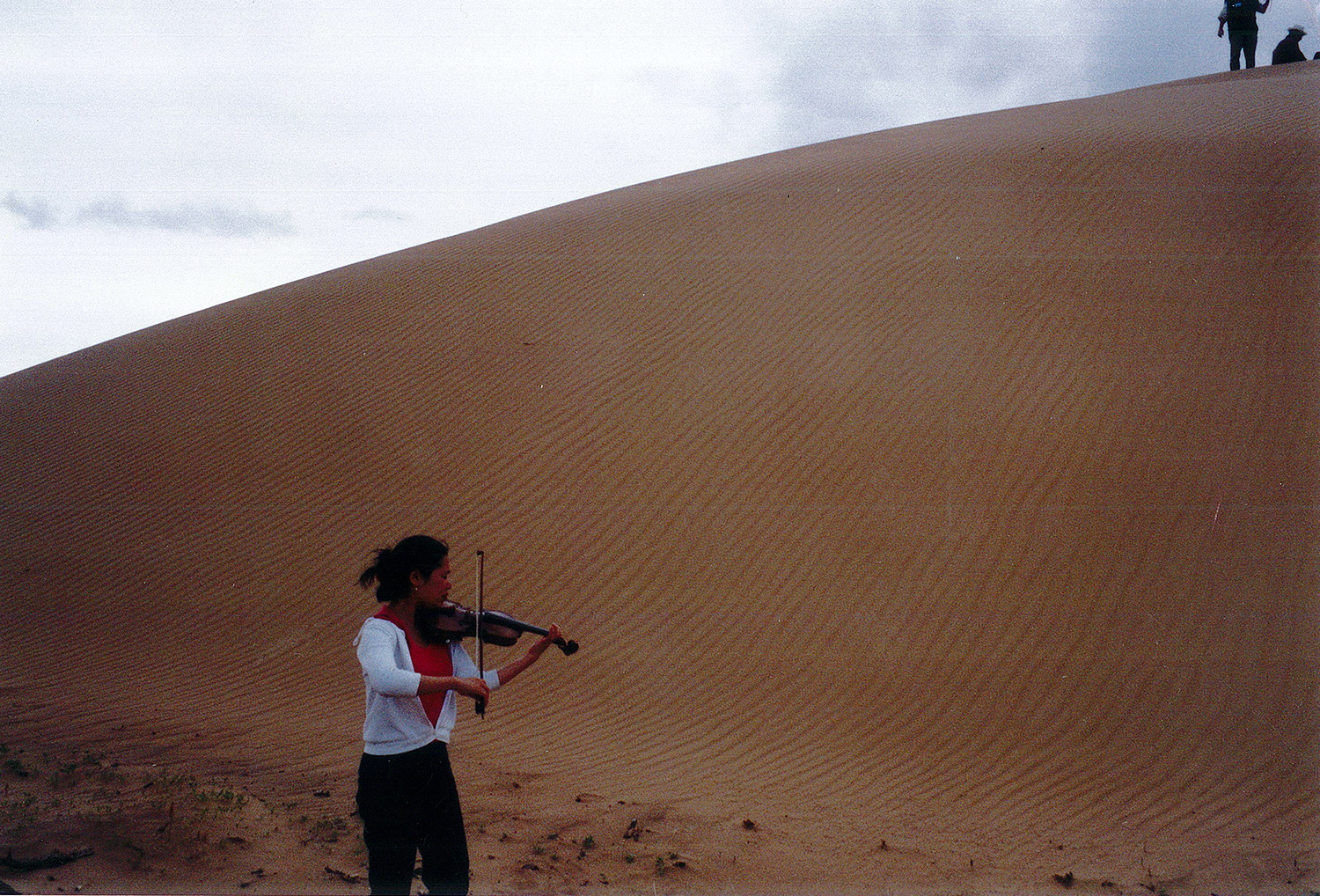 Performing at a sand dune in the Gobi Desert